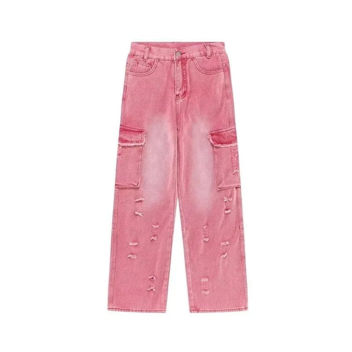 Un jean cargo baggy rose délavé pour femme avec déchirures judicieusement placées et taille haute. Un look audacieux des années 2000 revisité avec une touche ludique et féminine. Disponible en tailles du XS au XL.